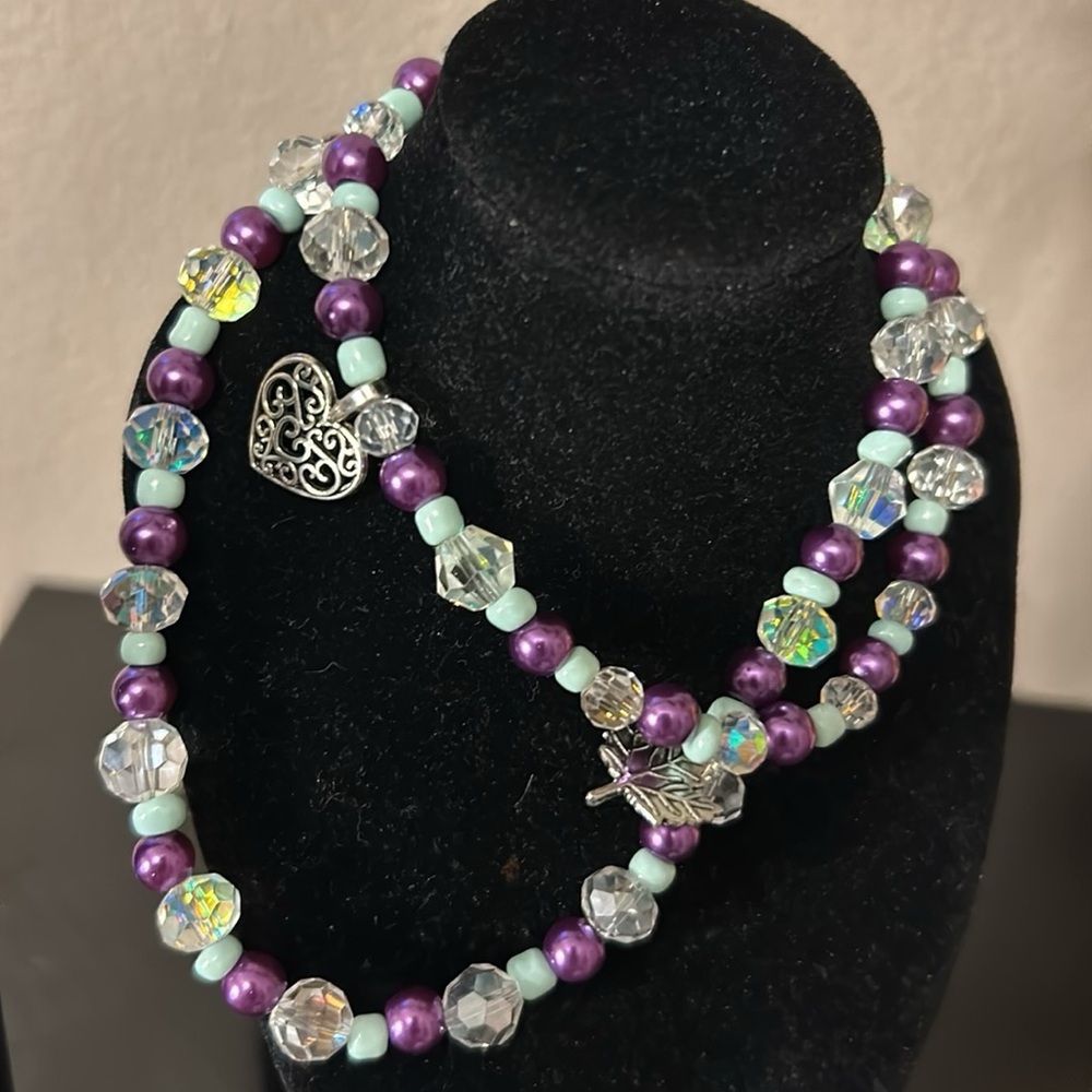 Luxury beaded necklace with purple iris, turquoise, and sterling silver accents